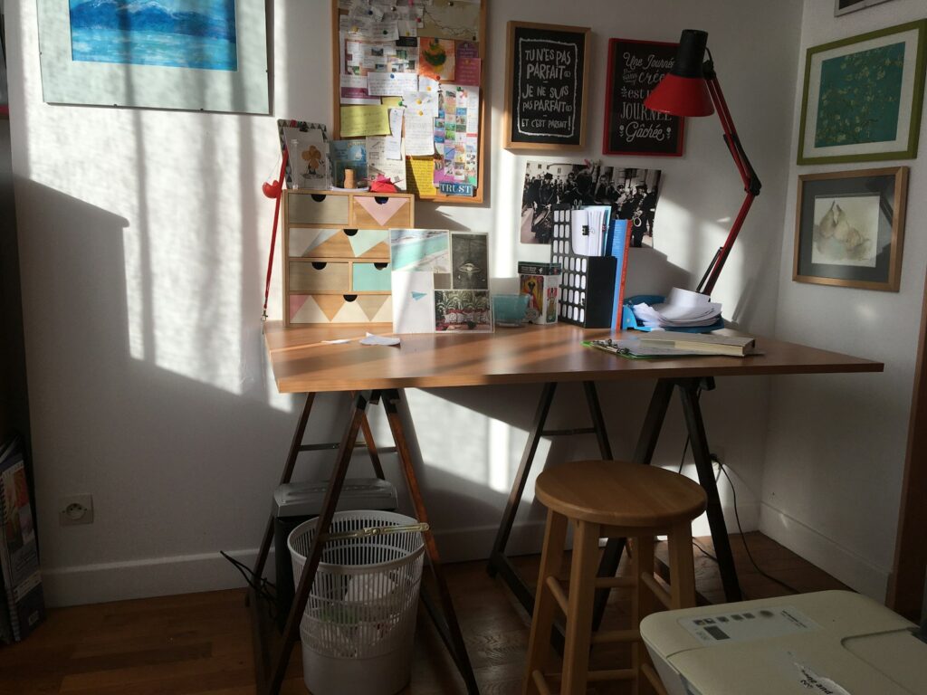 brown wooden table with black laptop computer on top