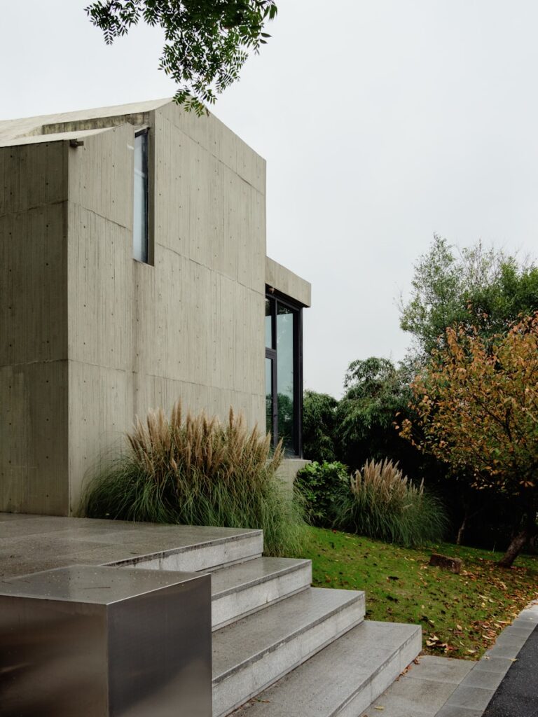 A concrete building with stairs leading up to it